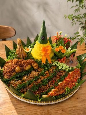 Tumpeng of yellow rice with side dishes